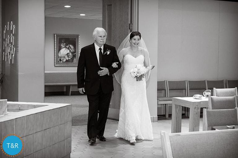 The father of the bride and Patty entering the ceremony