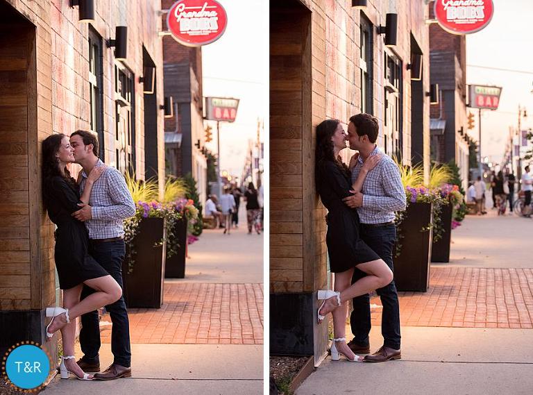 A couple kisses on the sidewalk in Corktown Detroit